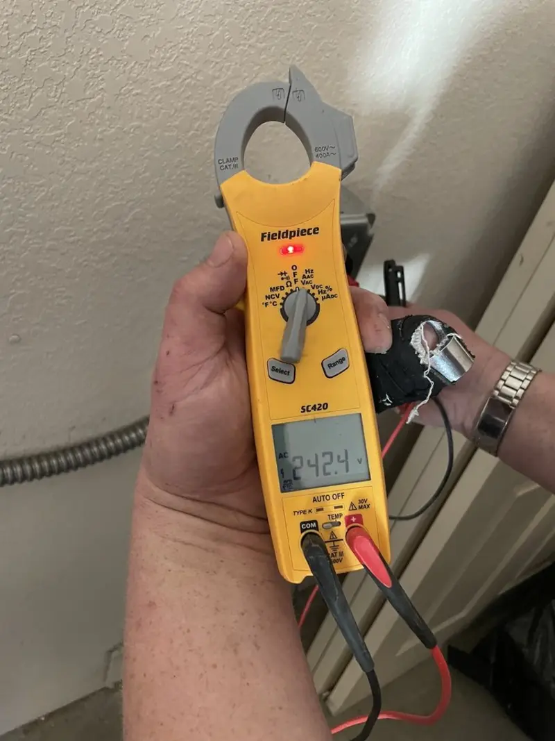 Voltage testing with clamp meter during Generator Installation in Hercules